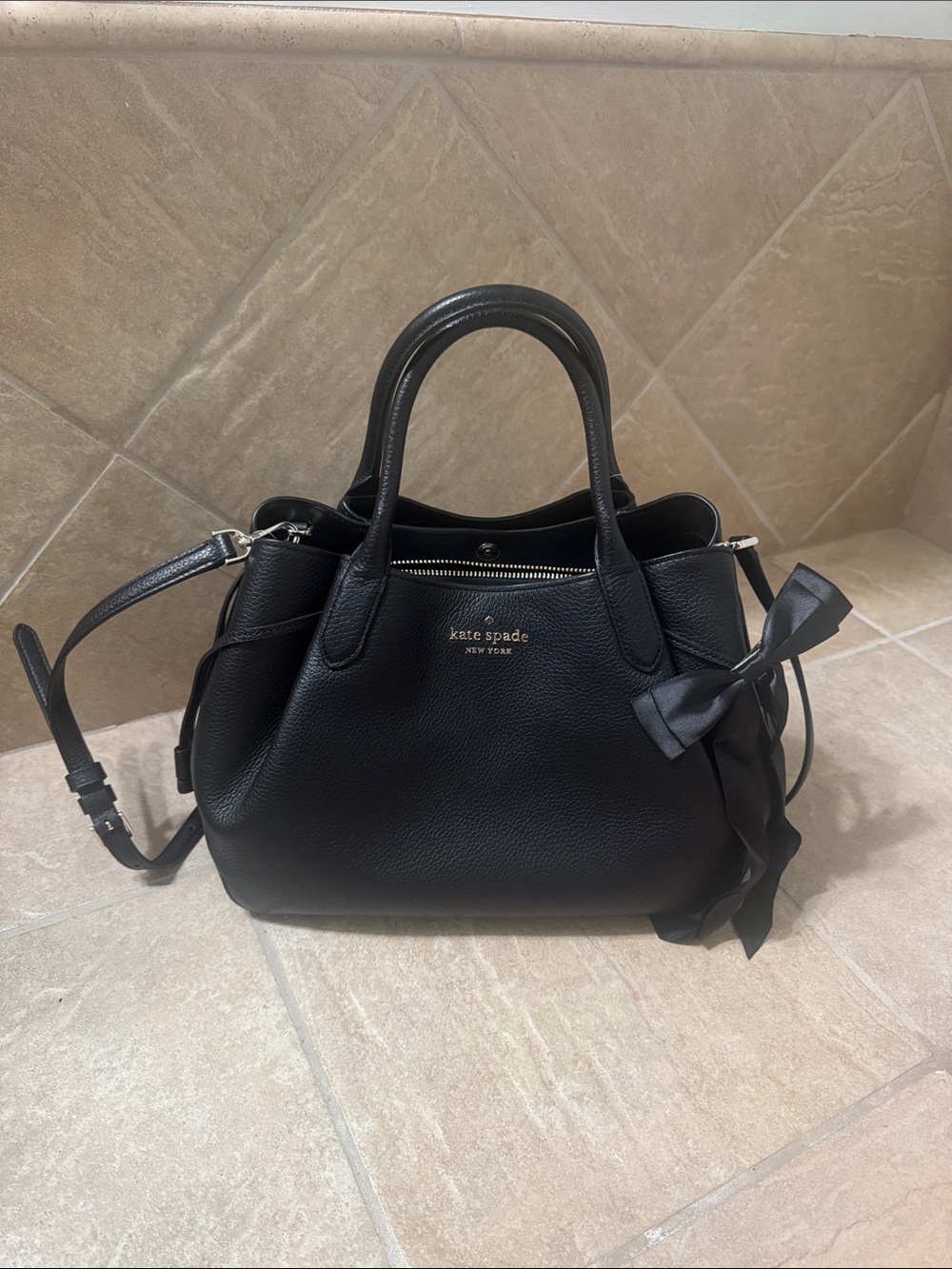 kate spade black leather satchel with bow detail and shoulder strap